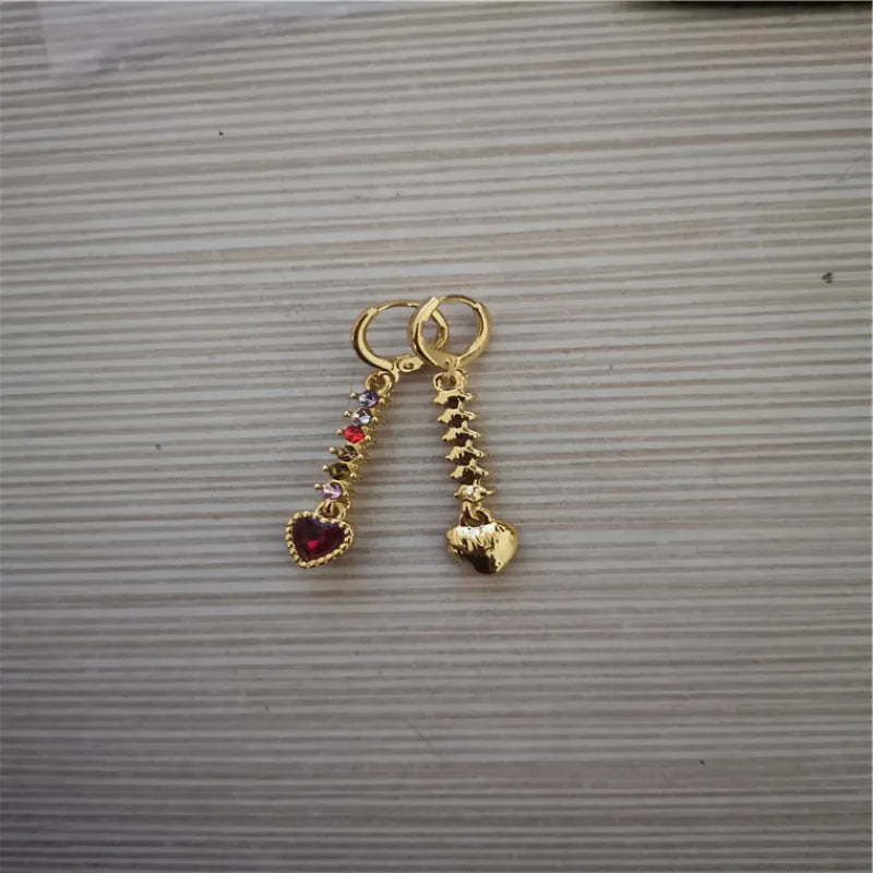 Pair of women's heart-shaped alloy earrings with electroplated gold or silver finish.