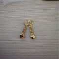 Pair of women's heart-shaped alloy earrings with electroplated gold or silver finish.