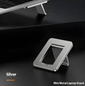 Small silver foldable aluminum laptop stand bracket with 3M adhesive strips on a white background.