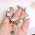 Green freshwater strawberry pearl bracelet with Chinese knot and peace buckle closure