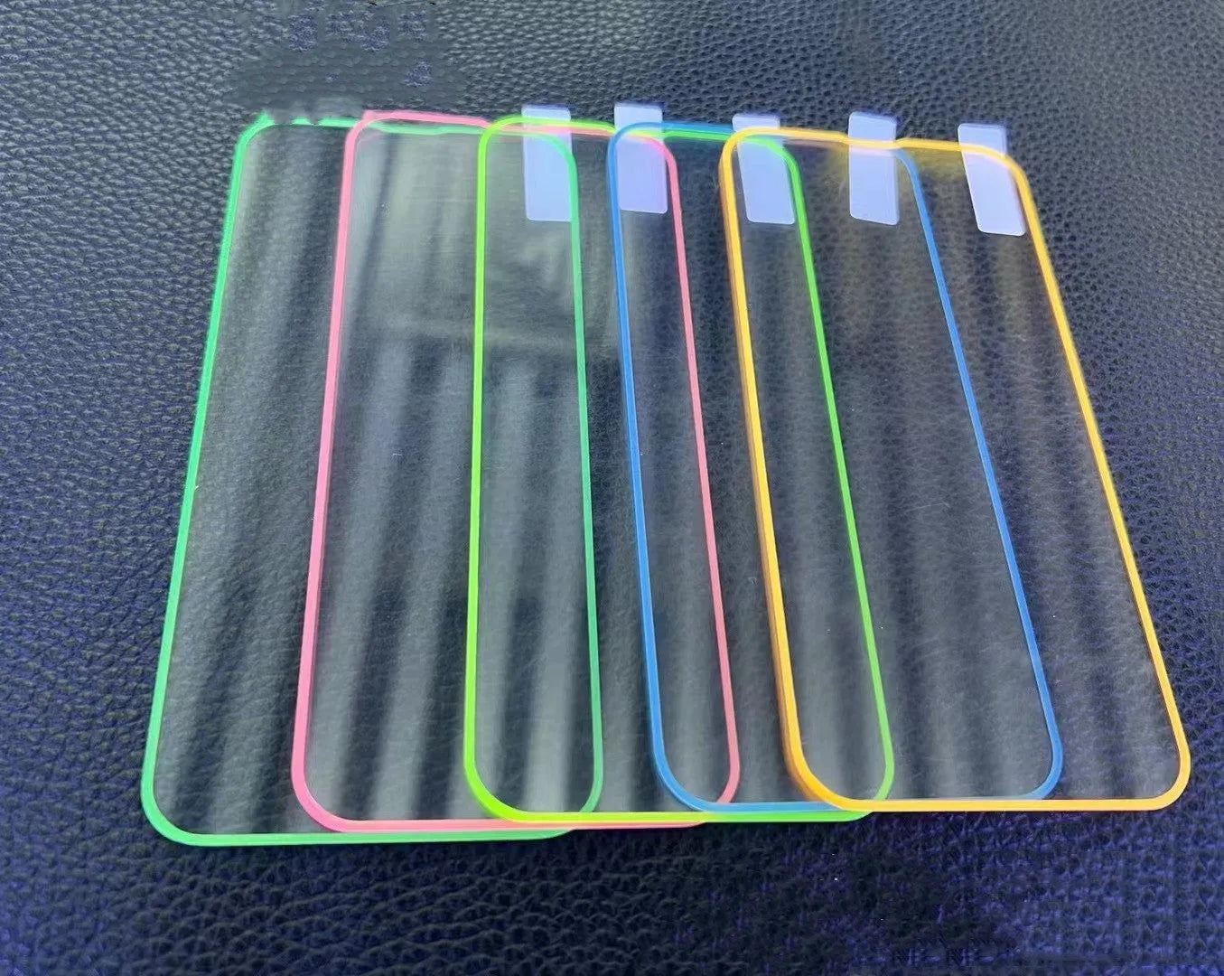 Fluorescent tempered glass screen protector for iPhone in blue luminous colour showing full front coverage.