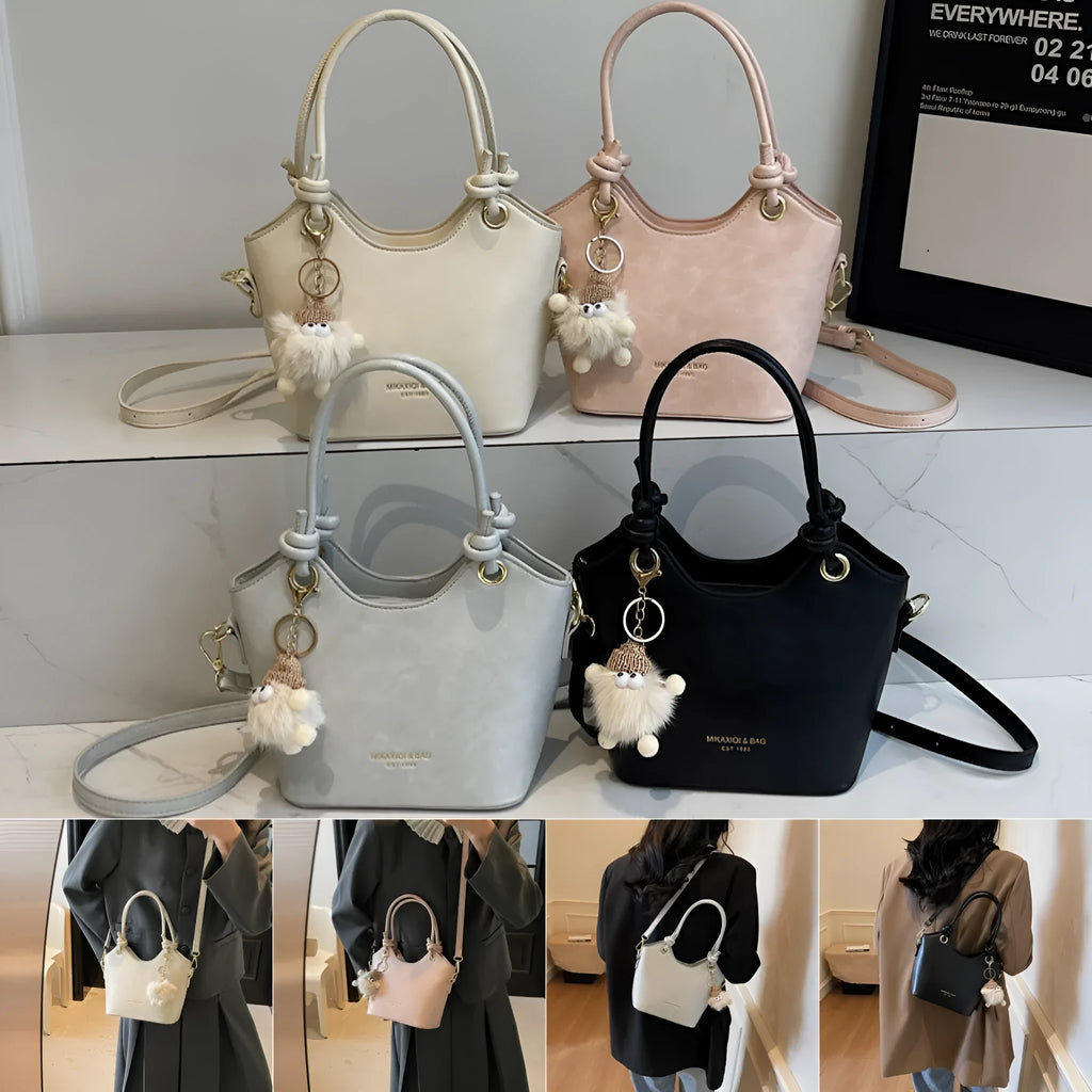 Small square PU crossbody bag in solid colour with zipper closure and single shoulder strap