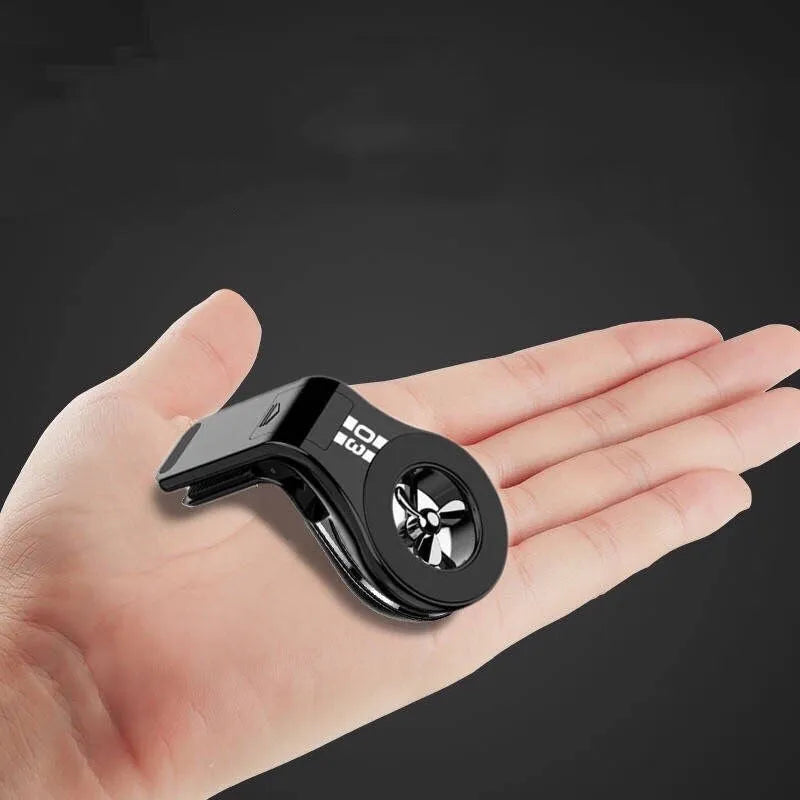 Magnetic car air vent phone holder with perfume diffuser in black, showing 360-degree rotation