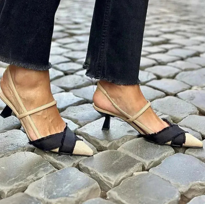 Women's apricot and black colour-block stiletto heel sandals with pointed toe and buckle fastening.