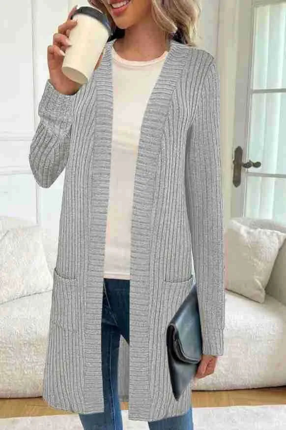 Women's plus size black knitted cardigan jacket with long sleeves and front pockets.