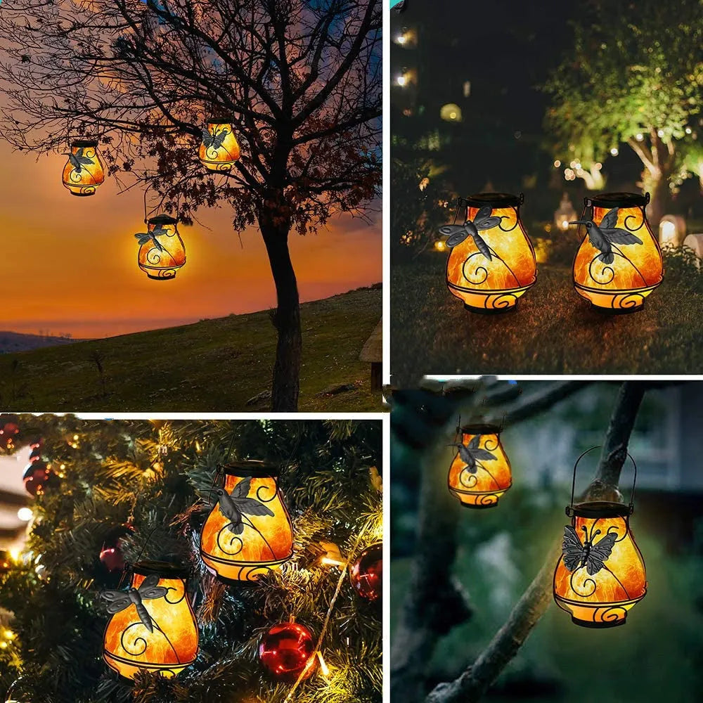 Solar courtyard light with butterfly flame motif, IP55 outdoor rating