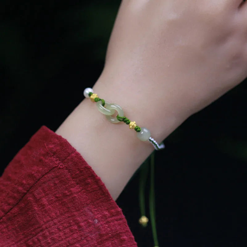 DIY woven bracelet with Hetian jade beads on a flexible wire band with silver or gold metal fittings.