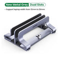 Silver aluminium alloy laptop cooling stand with adjustable width settings on a desk