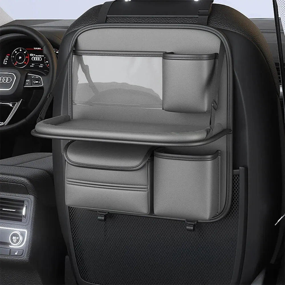 Car seat storage bag with foldable table in leather, hanging behind vehicle seat