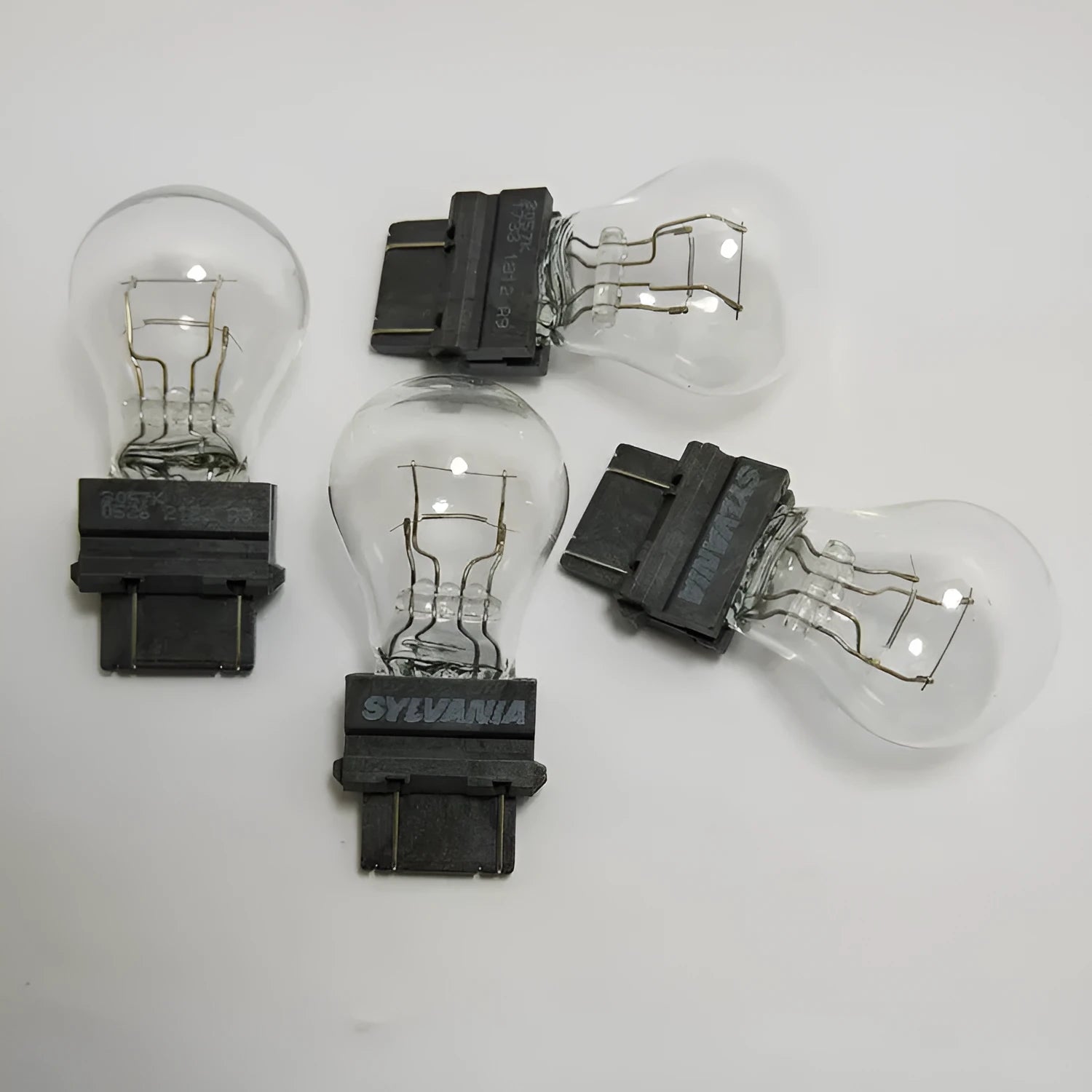 Wagner brake light bulb with dual wires, plastic alignment dots, and 16mm socket