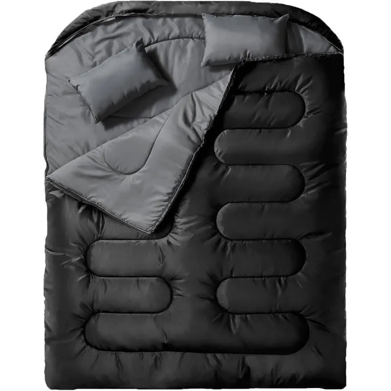 Portable pillow size polyester sleeping bag in black double colour, folded compact