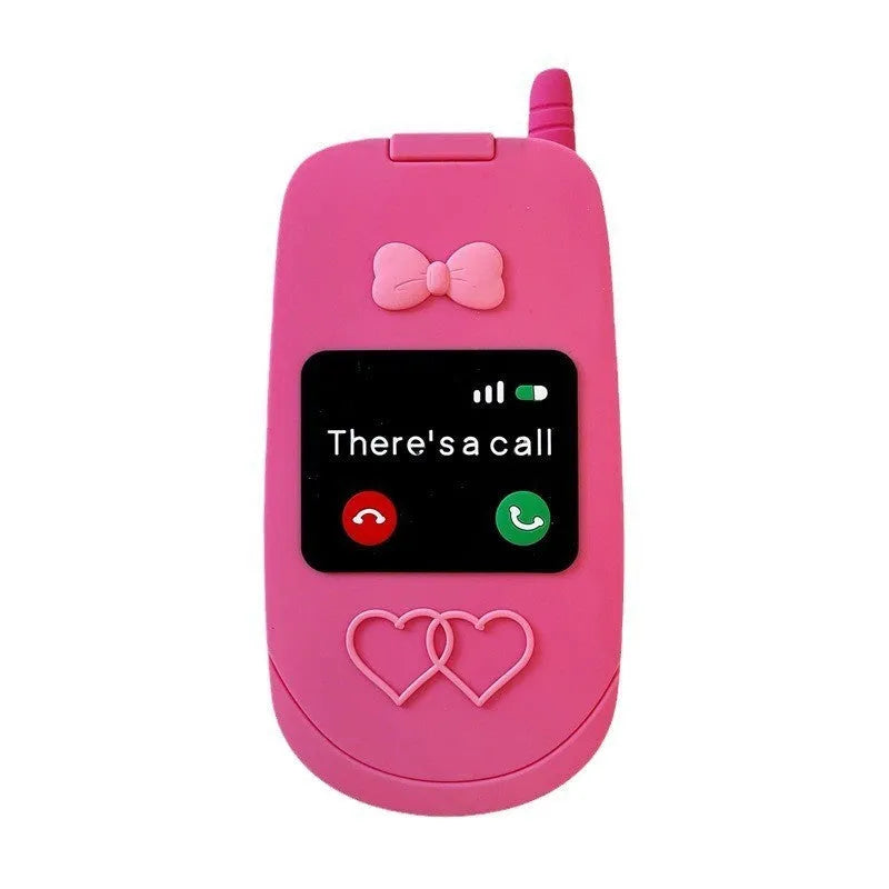 A light pink silicone iPhone case shaped like a flip phone with a built-in mirror on the front.