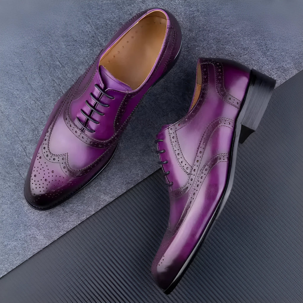 Purple men's Oxford shoes with hand-carved detailing and a pointed toe.
