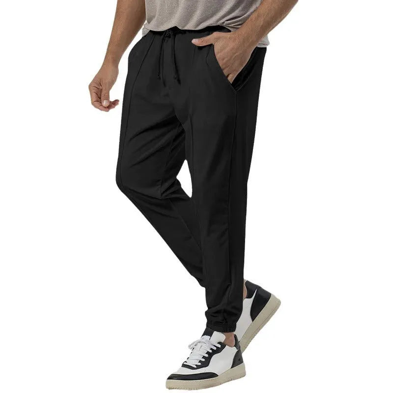 Men's gray loose-fit straight-leg track sweatpants with a mid waist