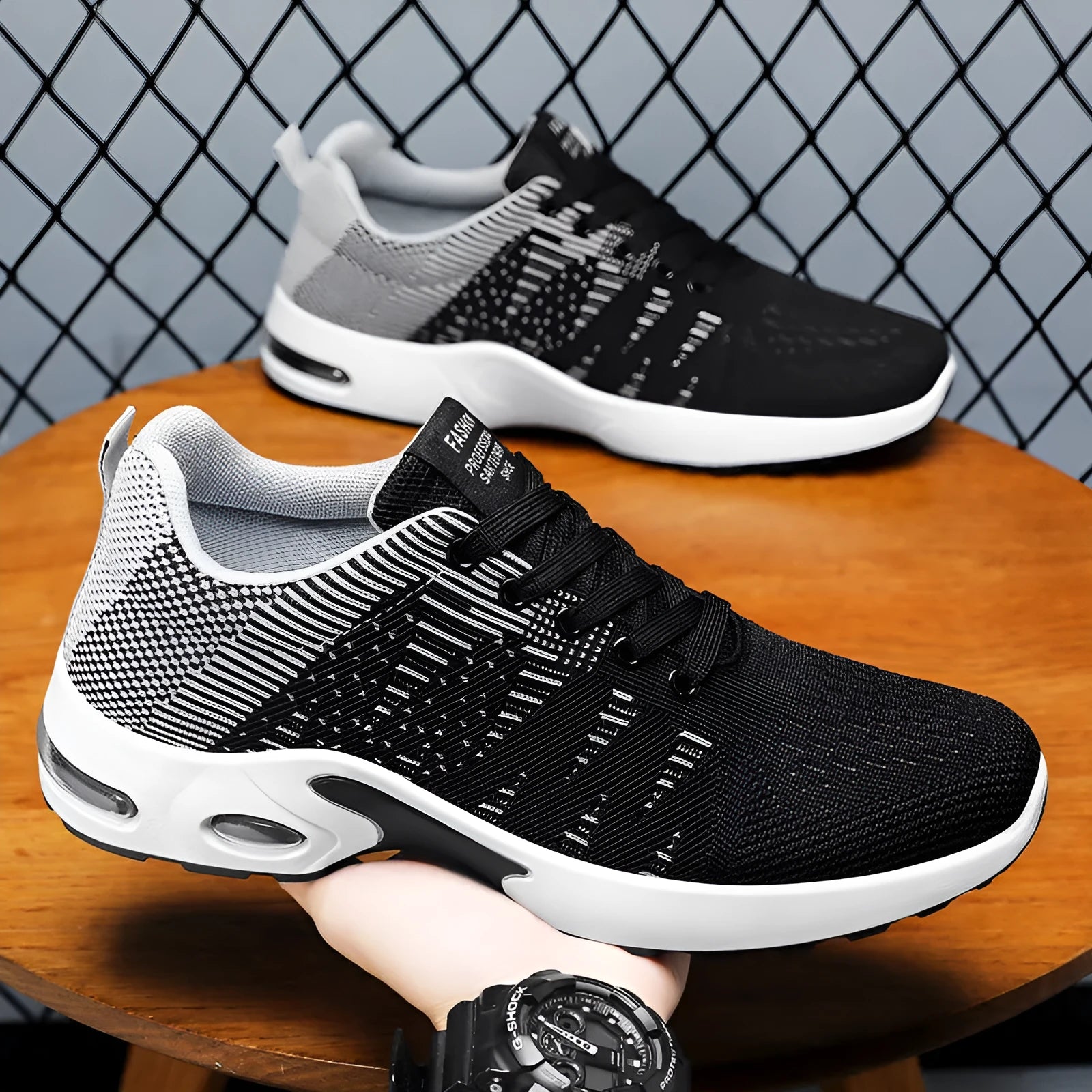 Men's black and gray Flyknit mesh casual sneakers with flat sole and lace-up front