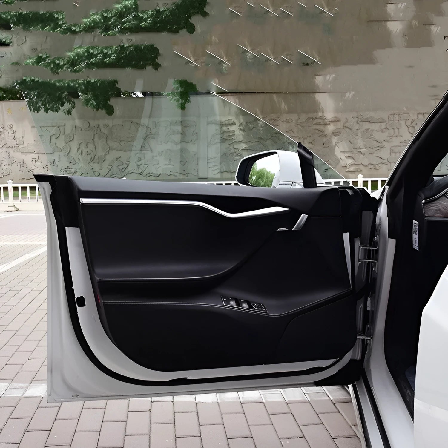 Clear carbon fibre protective film kit for Tesla Model S car door interior panels.