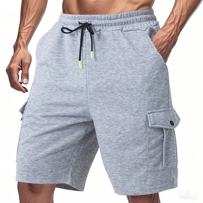 Men's heavy grey terry cloth cargo shorts with multiple pockets, shown in a loose fit for summer sports.