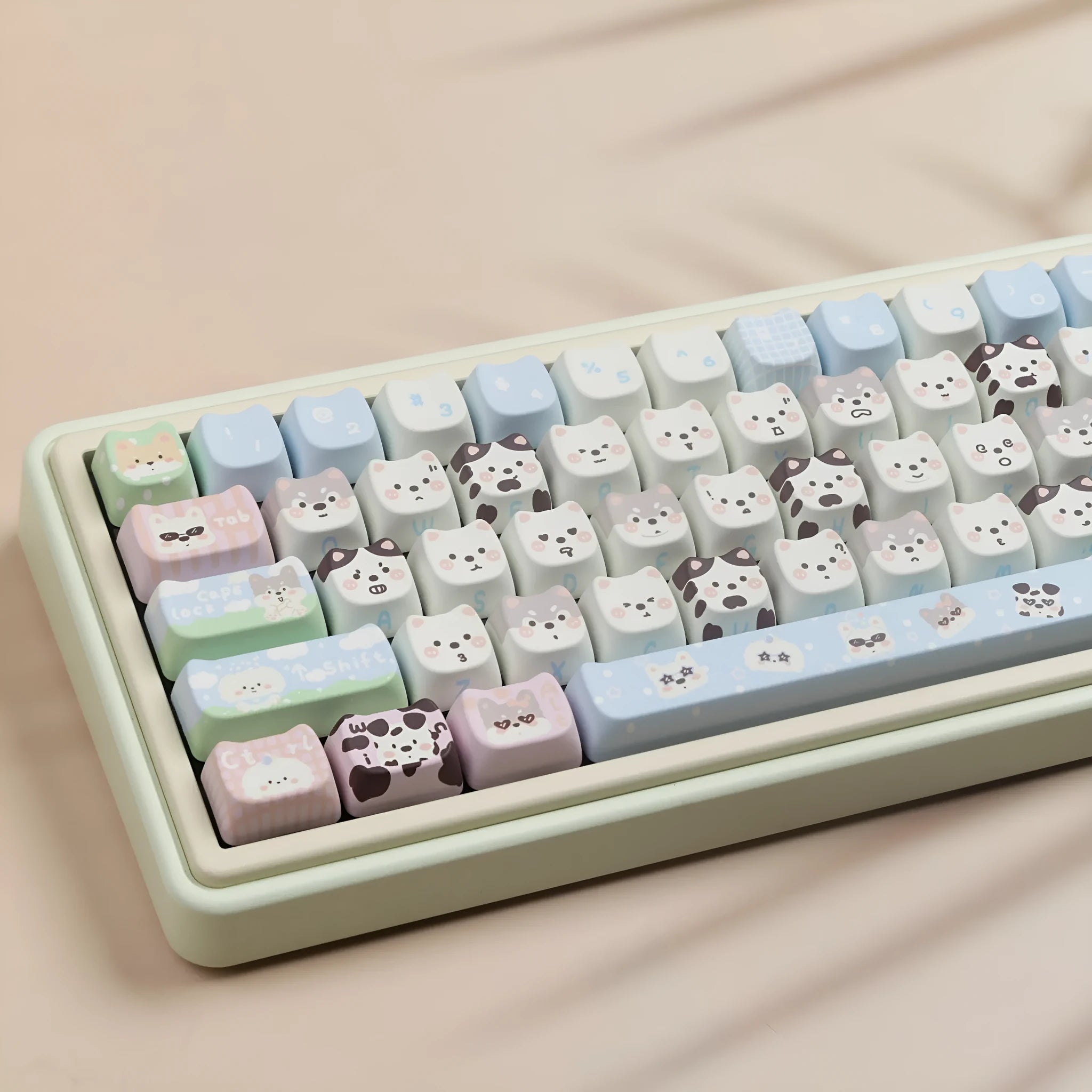 Full set of colourful PBT keyboard keycaps with sublimated cute puppy and cat designs laid out.