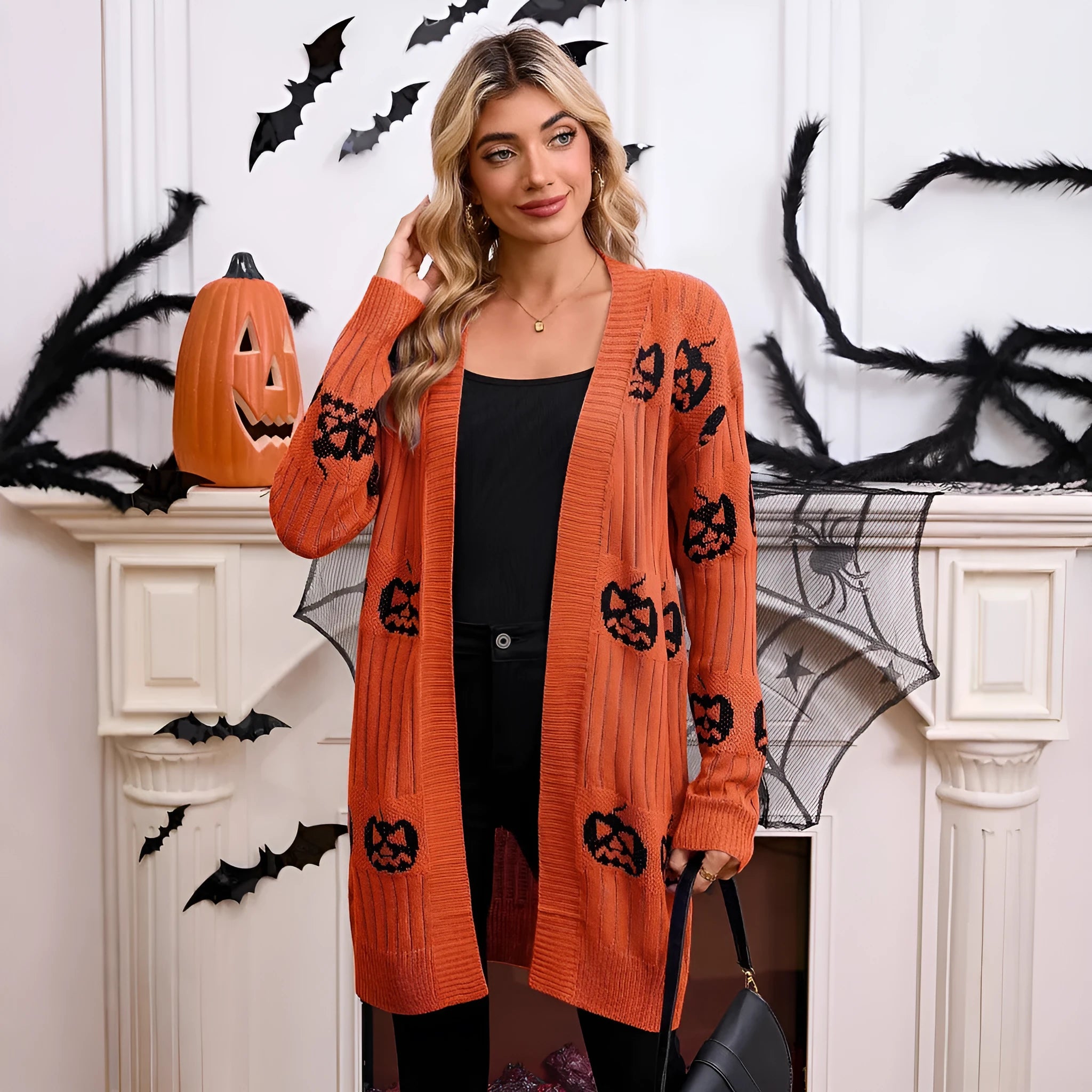 Women's black Halloween cardigan with orange pumpkin head jacquard knit pattern
