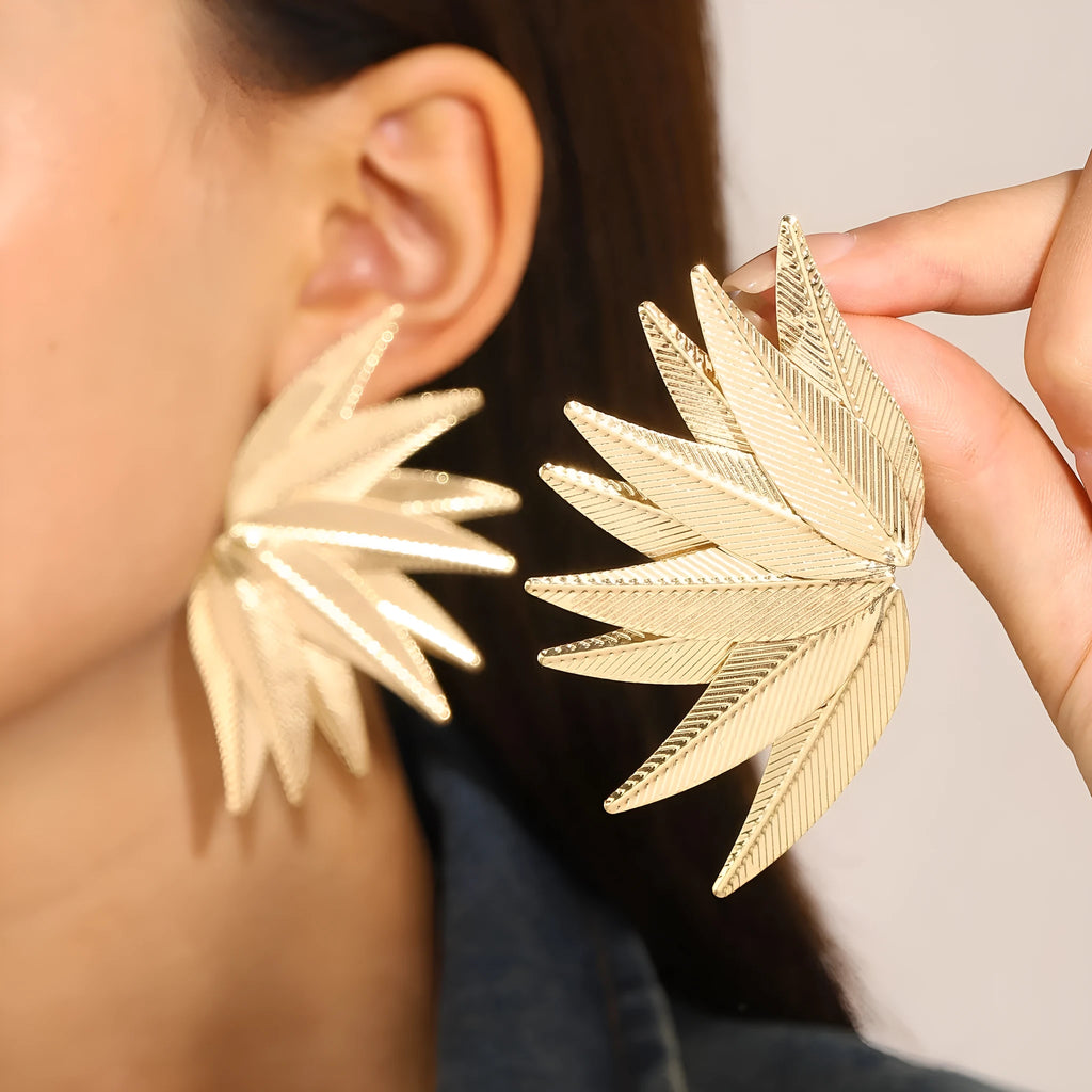 Gold and white leaves patch alloy earrings with leaf design texture