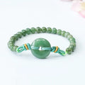 Natural emerald jade bracelet with star-shaped beads and a silver safety buckle.