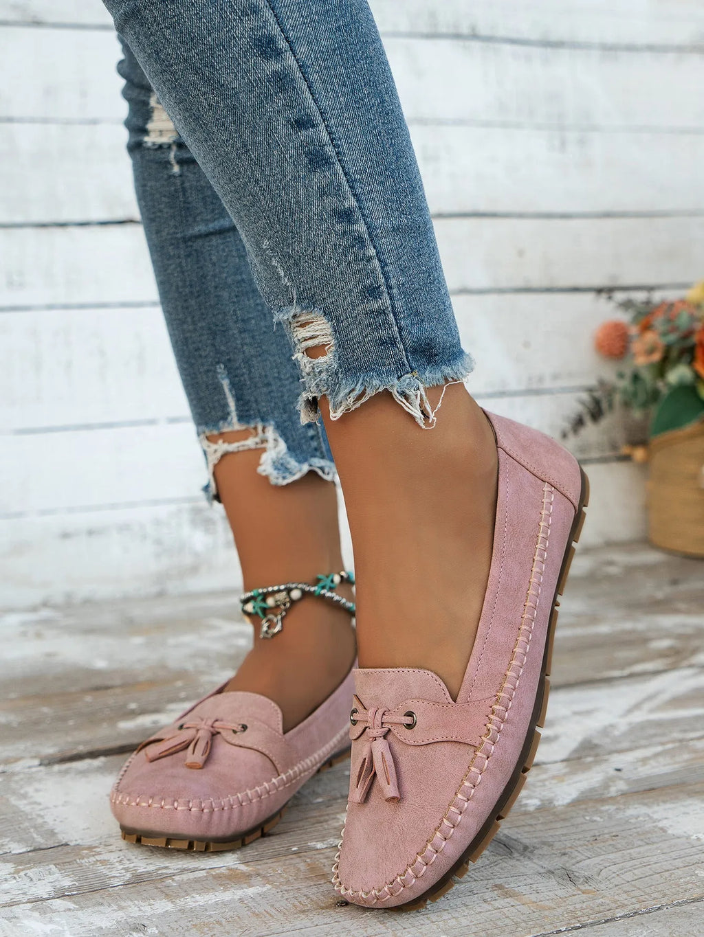 Women's suede flat shoes with a bow in pink, apricot, grey, or blue on a low polyurethane sole.