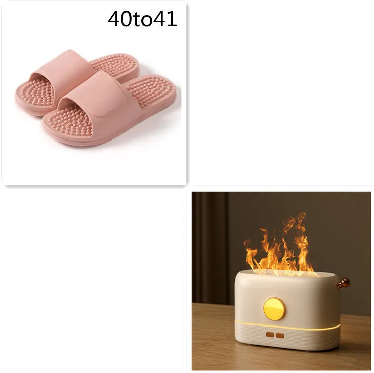 Black USB humidifier with LED flame simulation effect on wooden desk