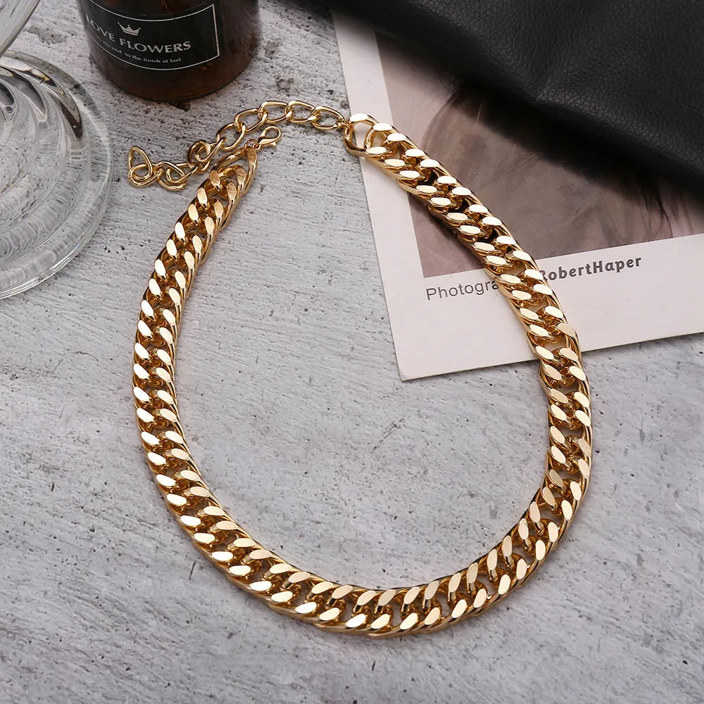Gold-coloured women's thick chain alloy necklace with a pendant, showing its 32cm length.