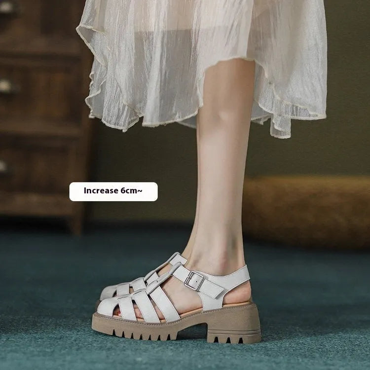 Women's black retro platform sandals with closed toe, chunky rubber sole and buckle fastening