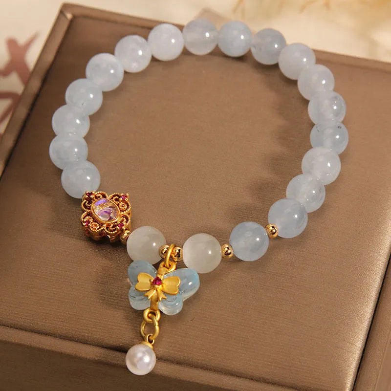 Women's aquamarine butterfly pendant bracelet with crystal and rhinestone details