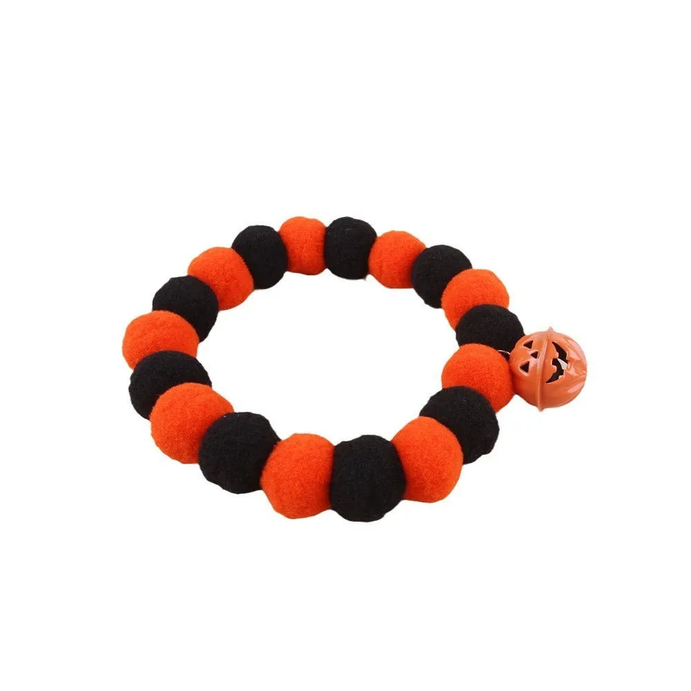 Orange Halloween cat collar with pumpkin design and adjustable snap buckle in three sizes