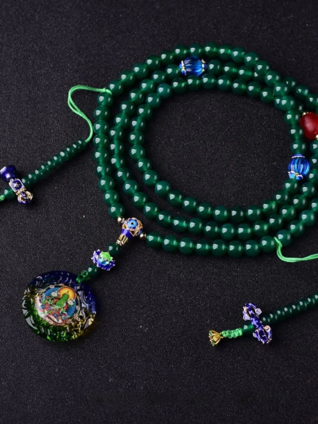 Natural green agate 108 bead bracelet with thangka pendant, worn as a multi-loop unisex accessory.