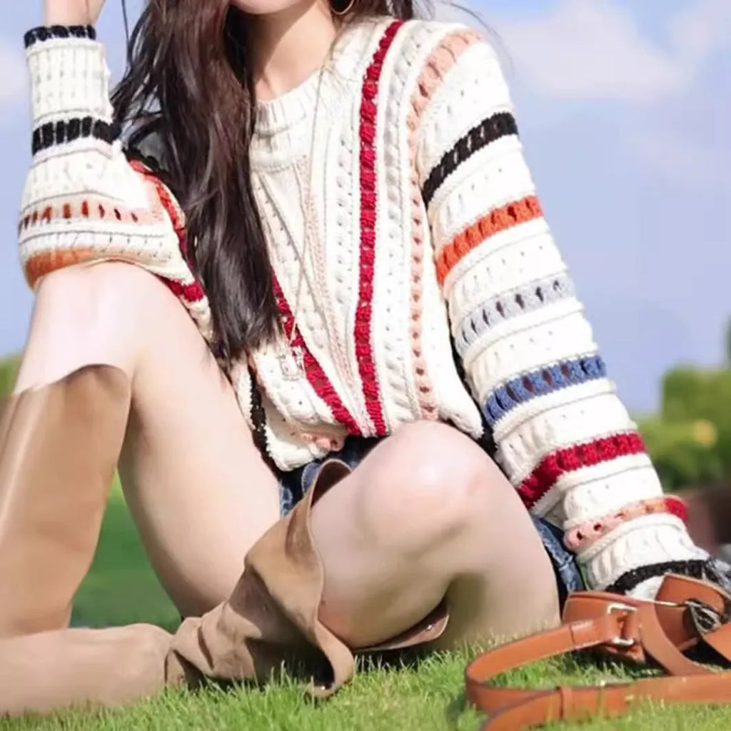 Women's rainbow striped loose sweater with batwing sleeves and hollow knit pattern