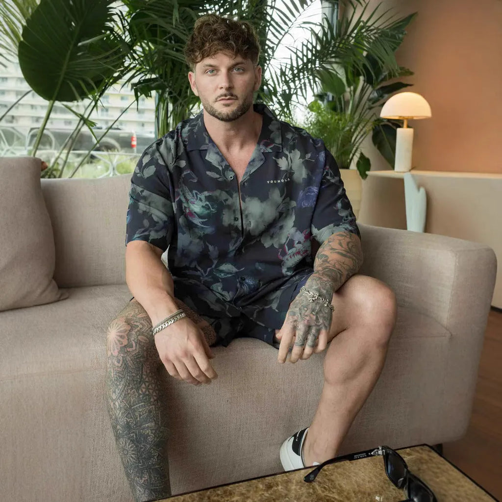 Man's loose-fitting short sleeve cardigan top with a floral print in light colours.