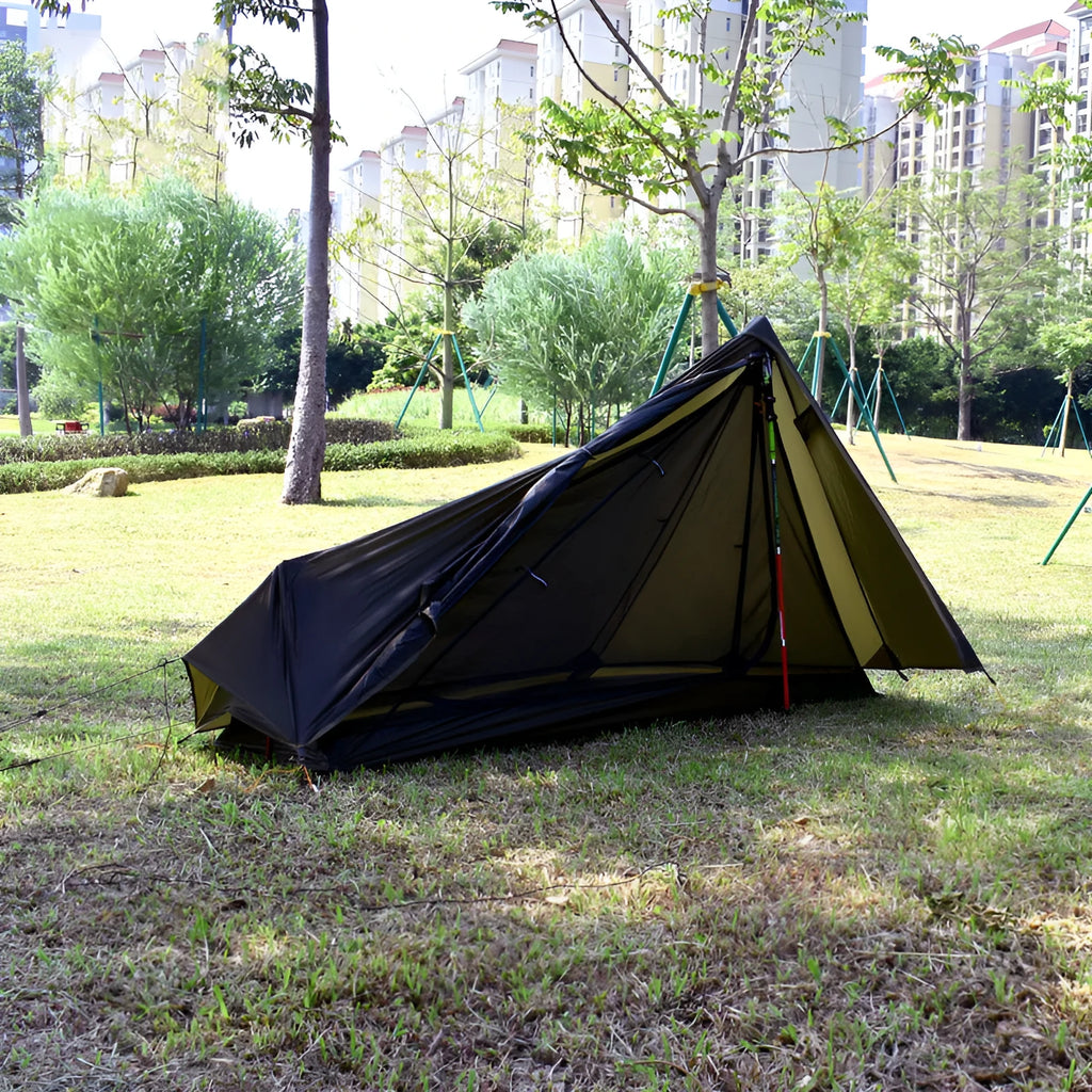 Single-person silicone-coated rodless tent in grey, 205x92x110cm, set up outdoors