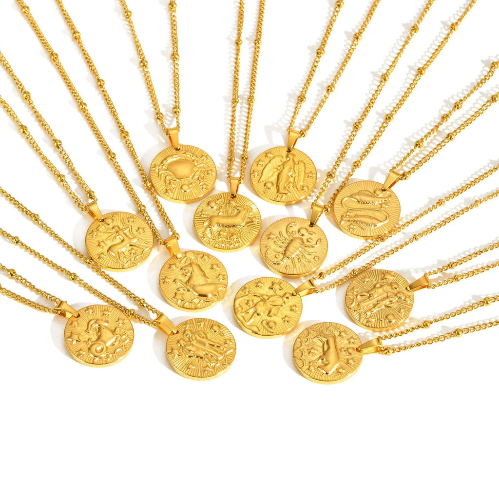 Stainless steel zodiac constellation necklace with round pendant showing embossed star signs on cross chain