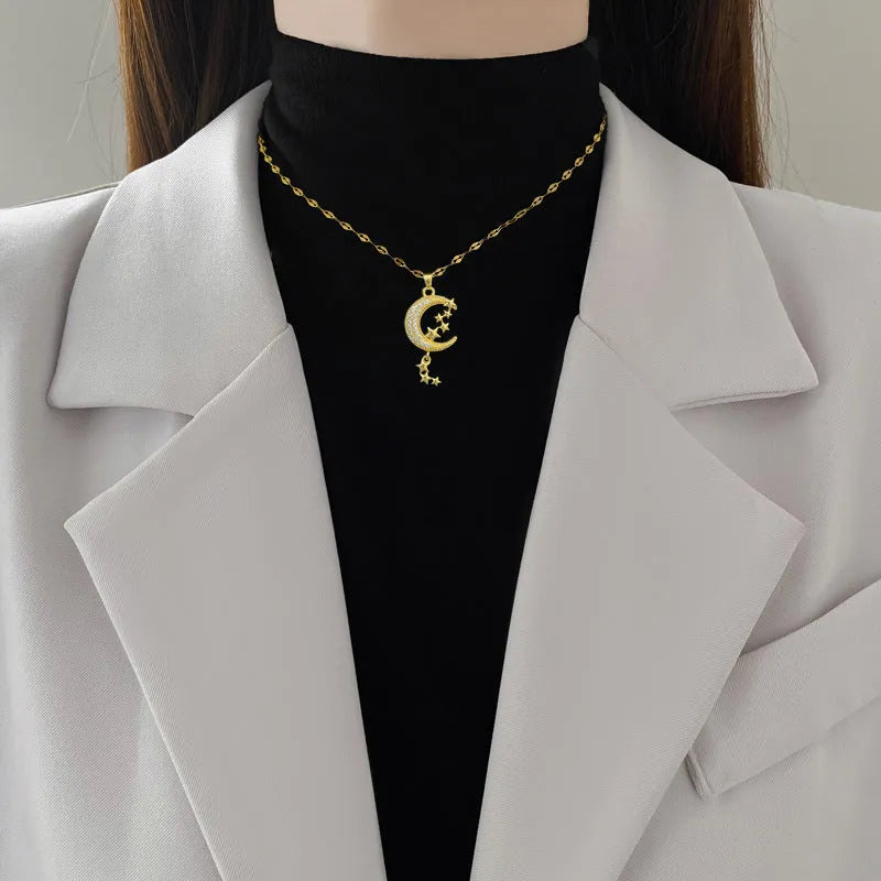 Moon tassel necklace with geometric full diamond copper pendant on stainless steel chain.