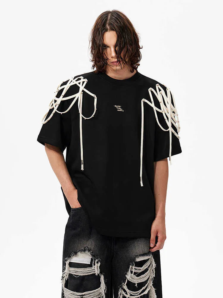 Black loose fit short-sleeved T-shirt with padded shoulders and rivet ribbon trim.