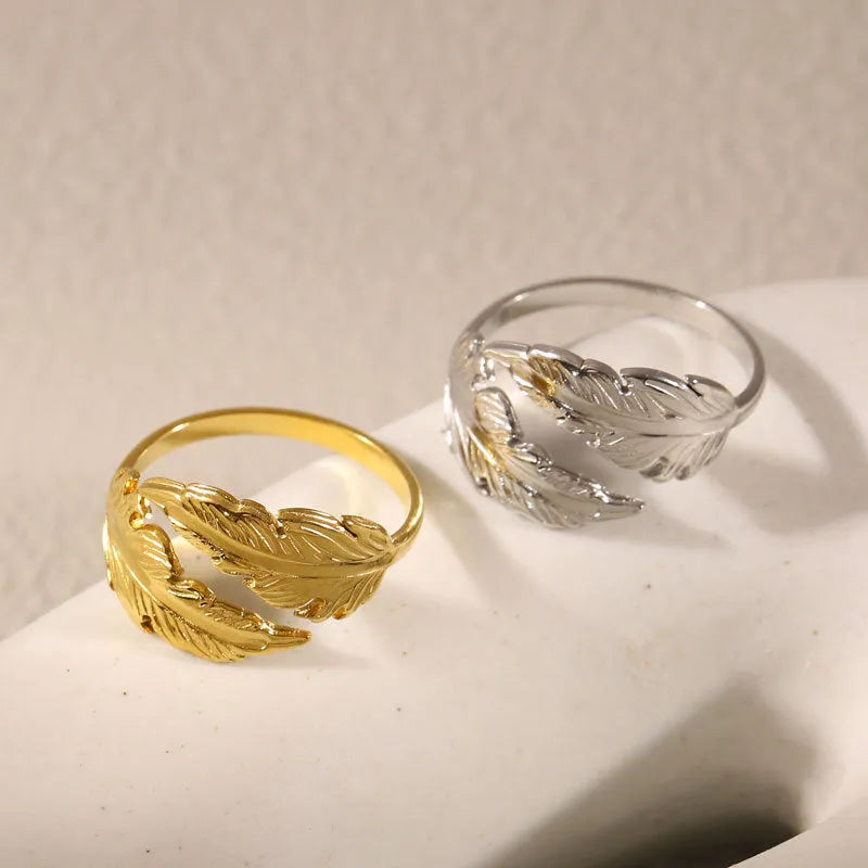 Adjustable titanium steel feather ring with silver electroplated finish on female hand