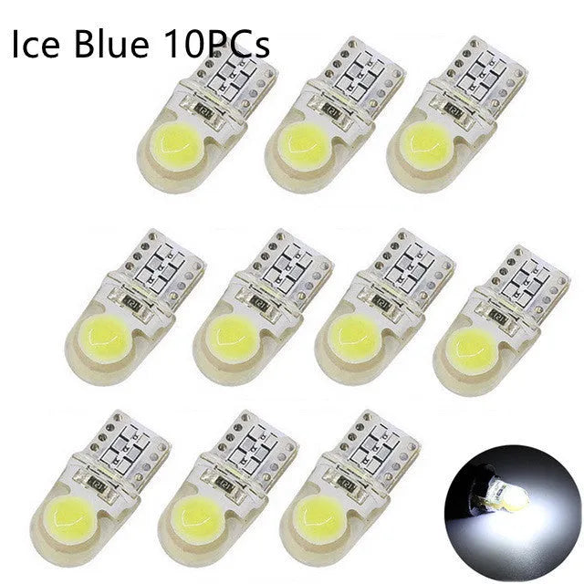 Ten T10 LED bulbs for cars in various colours including blue, red, and white, showing their 21.5mm length.