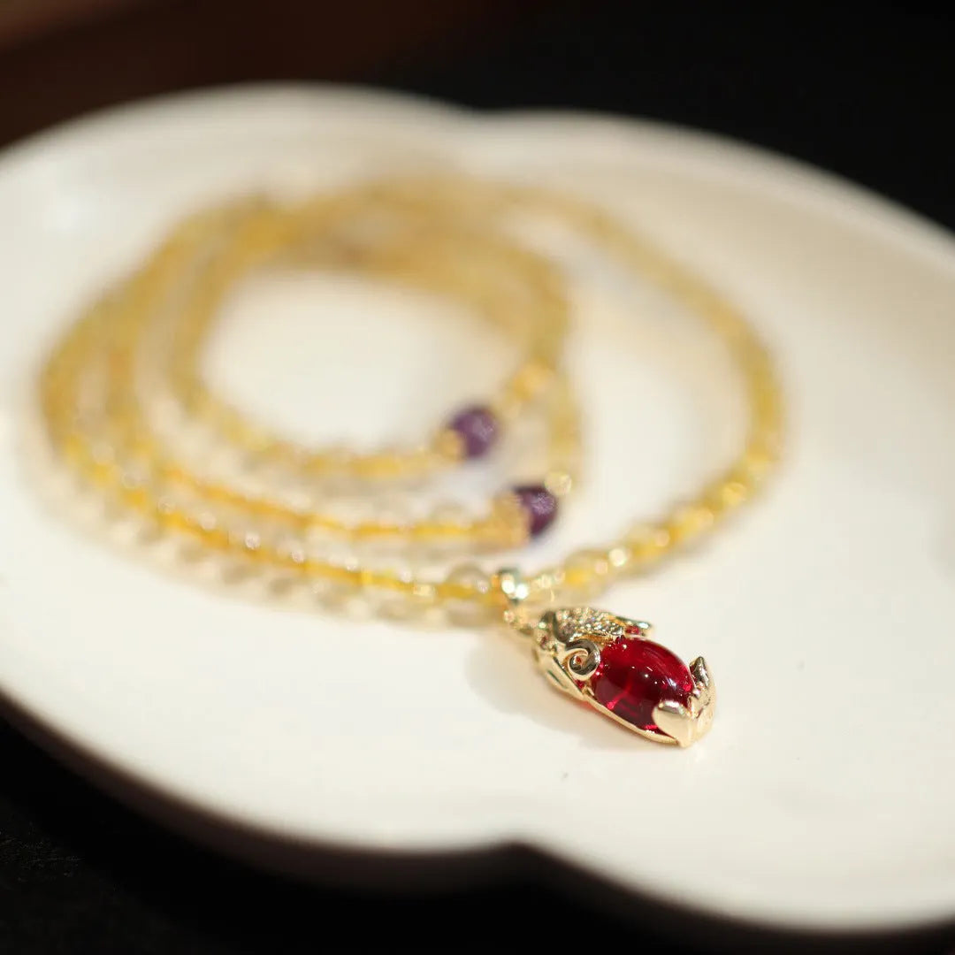 Natural Brazilian gold rutilated quartz bracelet with three gold beads and hanging chopsticks ornament