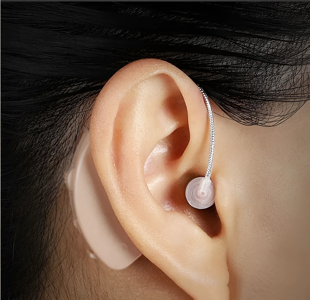 Black rechargeable hearing aid amplifier with silicone ear tips for elderly hearing support