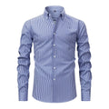 Man wearing a striped long-sleeved non-iron business casual shirt with a lapel collar.
