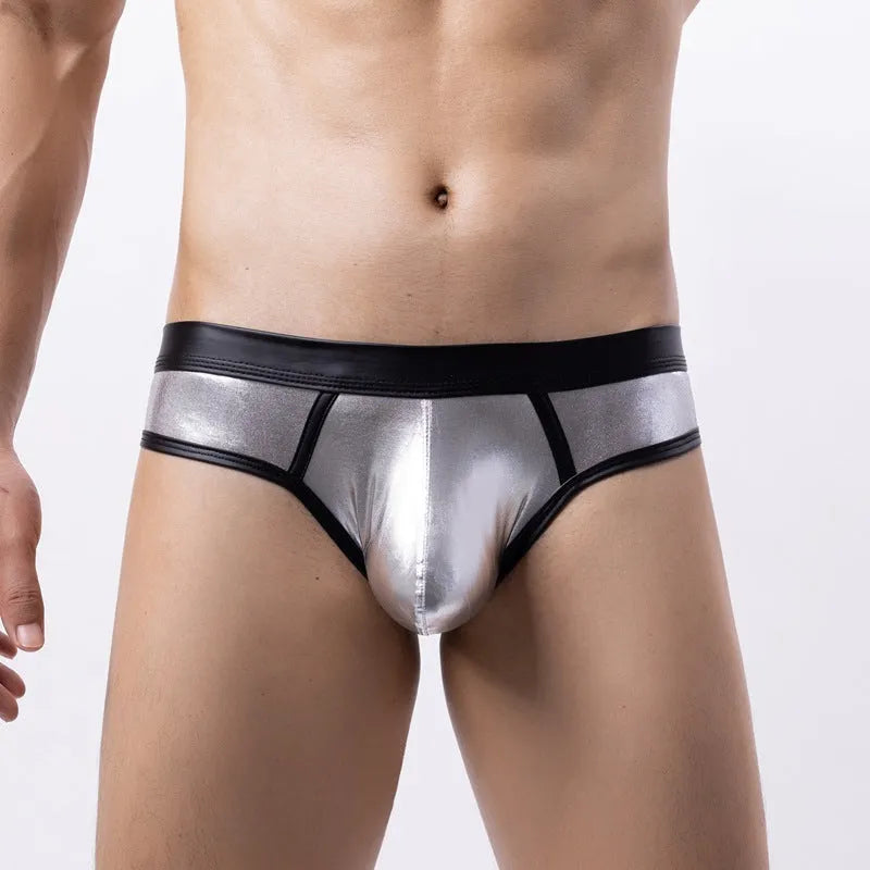 Men's gold patent leather polyester bikini swim briefs on a plain background
