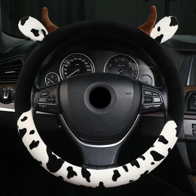Short plush steering wheel cover with protective handle section in black colour