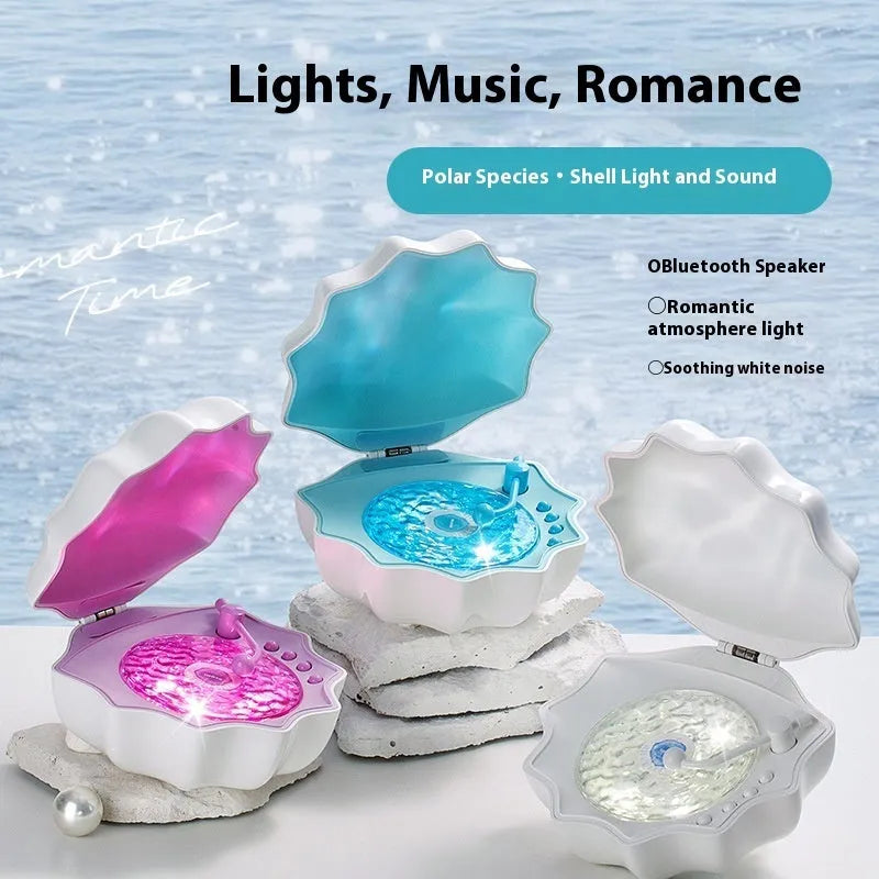 Wireless Bluetooth mini shell light stereo speaker in Aurora Purple with wave light on