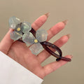 Retro flower bobby pin with acrylic petals in blue, beige, light blue, or pink colour options