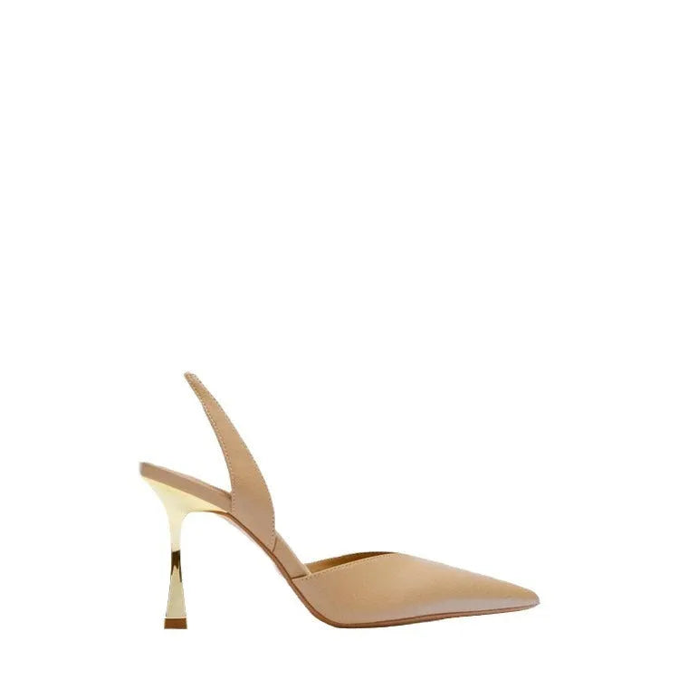 Women's pointed patent leather high heels in apricot colour on a white background.