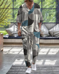 A thin polyester trousers suit with a V-neck jacket featuring cropped sleeves, shown alongside the matching trousers.