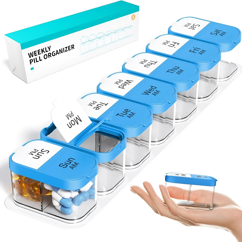 Large white and rainbow coloured plastic pill box with 14 removable compartments open on a table.